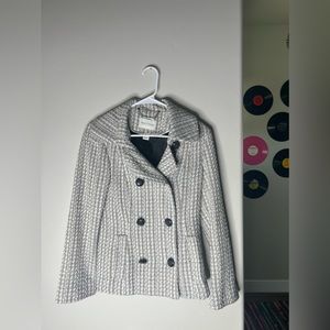Black house, white market, black and white tweed jacket